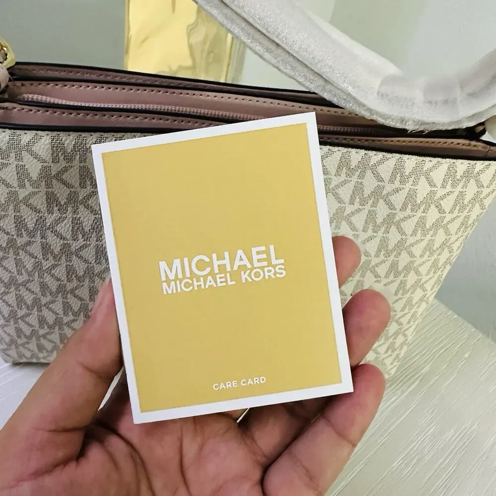 Michael Kors Trisha Medium Logo Crossbody Bag in a vanilla/light cream and pink